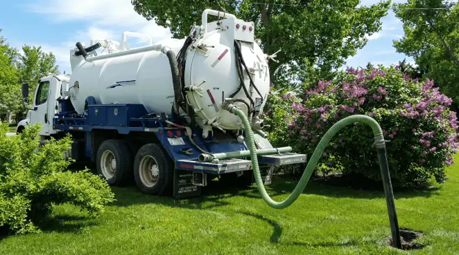 Professional vacuum truck performing residential drainage and septic maintenance in Cape Coral, FL